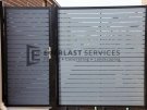 SS39 – Black Post + Frame with Woodland Grey Aluminium Slats Single Gate with Panel – Laverton