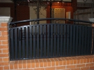 SF46 – Black Vertical Slats with Feature Ring Steel Fencing Infills