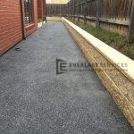 EA1 - Dark Exposed Aggregate Side of House