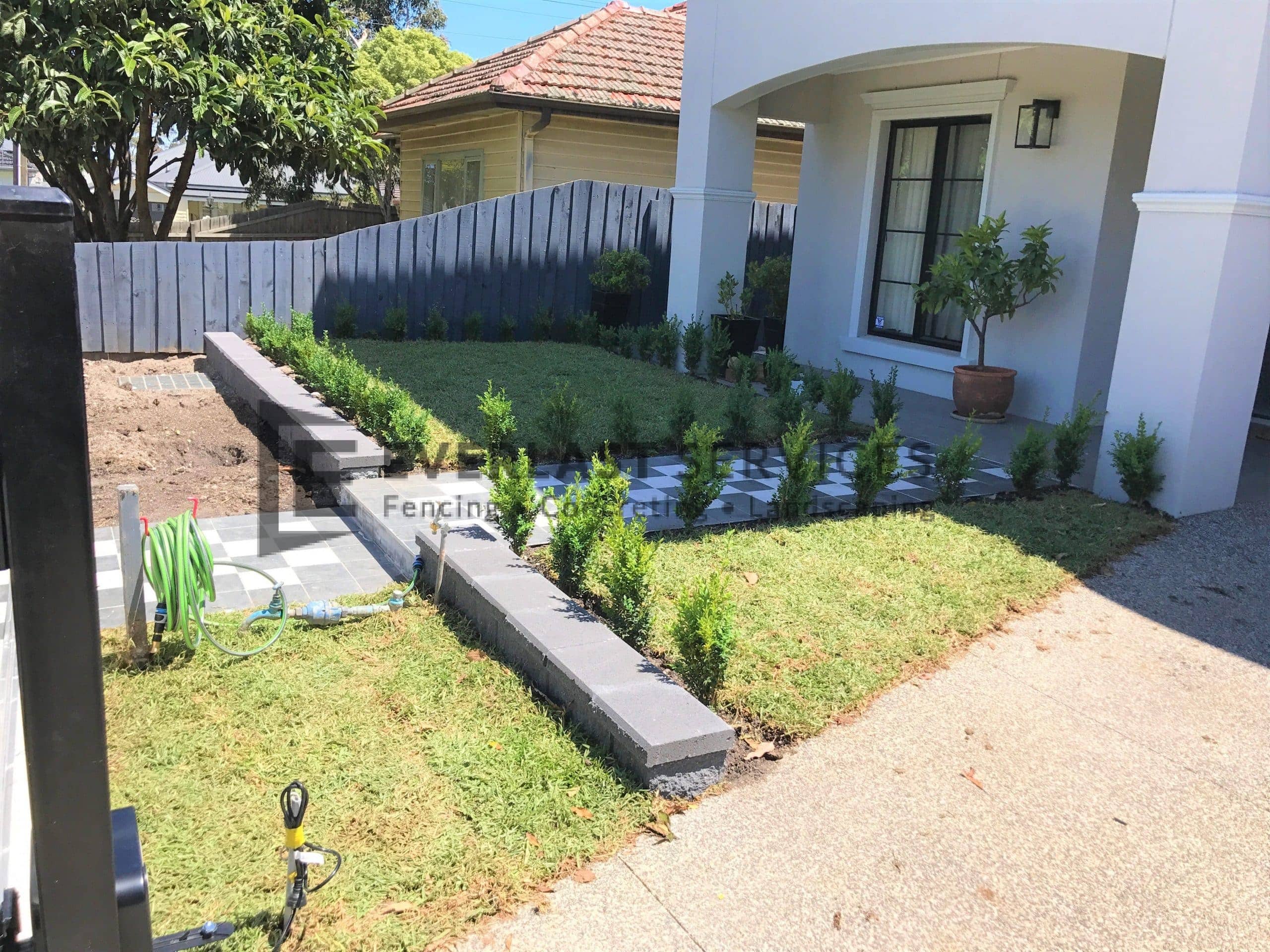 L196 - Front Landscaping with Tiling and Retaining Wall
