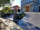 L282 – Landscaping front yard with stamped concrete path