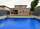 L284 – Yarraville – Backyard Landscaping with Glass Pool Fence looking directly at the house